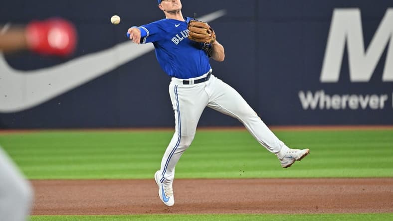 Aug 26, 2023; Toronto, Ontario, CAN;  Toronto Blue Jays third baseman Matt Chapman (26) throws to retire Cleveland Guardians left fielder Oscar Gonzalez (not shown) in the fourth inning at Rogers Centre. Mandatory Credit: Dan Hamilton-USA TODAY Sports