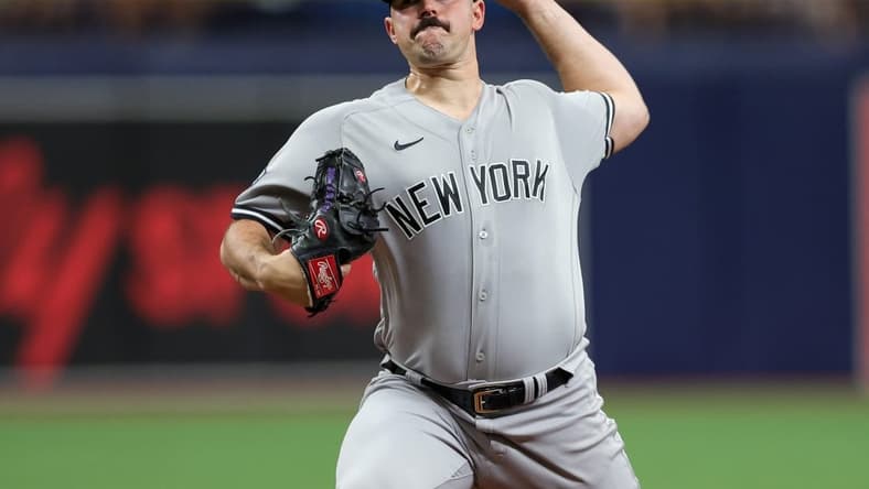 Aug 27, 2023; St. Petersburg, Florida, USA;  New York Yankees starting pitcher Carlos Rodon (55) throws a pitch against the Tampa Bay Rays in the first inning at Tropicana Field. Mandatory Credit: Nathan Ray Seebeck-USA TODAY Sports