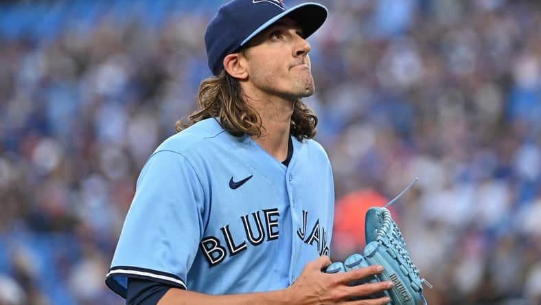 Aug 28, 2023; Toronto, Ontario, CAN;  Toronto Blue Jays starting pitcher Kevin Gausman (34) reacts after giving up a run to the Washington National in the first inning at Rogers Centre. Mandatory Credit: Dan Hamilton-USA TODAY Sports