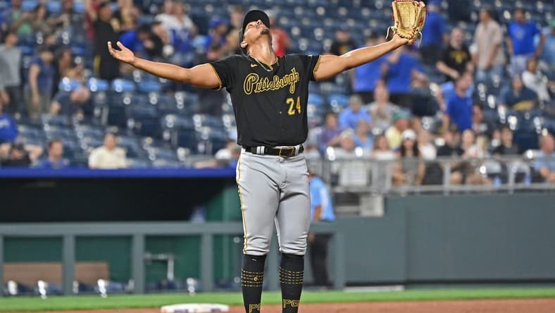 Aug 28, 2023; Kansas City, Missouri, USA;  Pittsburgh Pirates starting pitcher Johan Oviedo (24) celebrates after throwing a complete game shutout to beat the Kansas City Royals at Kauffman Stadium. Mandatory Credit: Peter Aiken-USA TODAY Sports