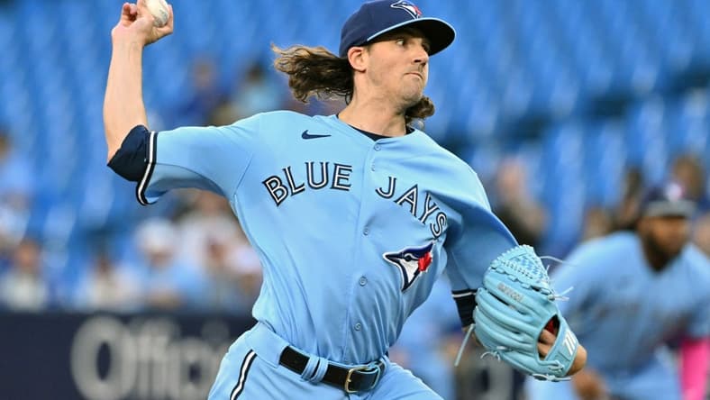Aug 28, 2023; Toronto, Ontario, CAN;  Toronto Blue Jays starting pitcher Kevin Gausman (34) delivers a pitch against the Washington National in the first inning at Rogers Centre. Mandatory Credit: Dan Hamilton-USA TODAY Sports