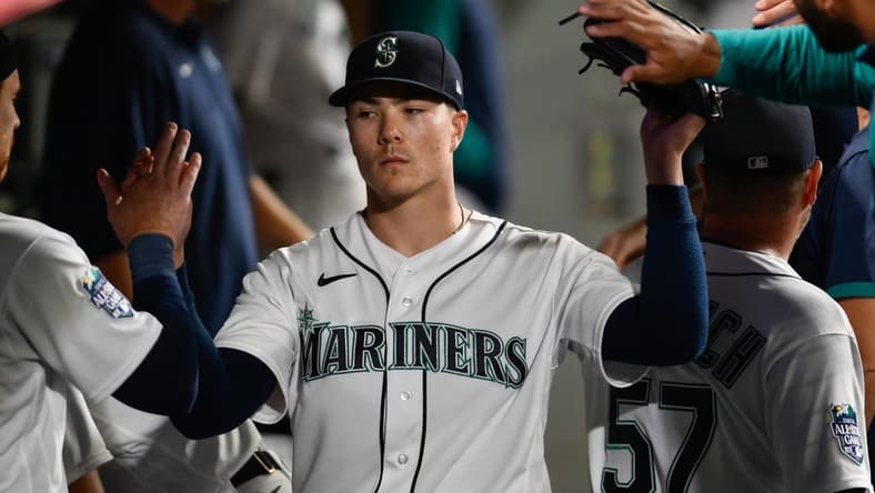 Aug 28, 2023; Seattle, Washington, USA; Seattle Mariners starting pitcher Bryan Woo (33) in the dugout during the sixth inning against the Oakland Athletics at T-Mobile Park. Mandatory Credit: Steven Bisig-USA TODAY Sports