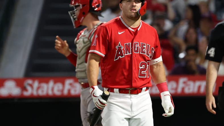 Aug 22, 2023; Anaheim, California, USA; Los Angeles Angels center fielder Mike Trout (27) walks back to the dugout during the MLB game against the Cincinnati Reds at Angel Stadium. Mandatory Credit: Kiyoshi Mio-USA TODAY Sports
