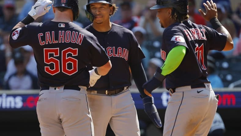 Aug 30, 2023; Minneapolis, Minnesota, USA; Cleveland Guardians first baseman Kole Calhoun (56) celebrates with catcher Bo Naylor (23) and third baseman Jose Ramirez (11) after hitting a three-run home run against the Minnesota Twins in the tenth inning at Target Field. Mandatory Credit: Bruce Kluckhohn-USA TODAY Sports