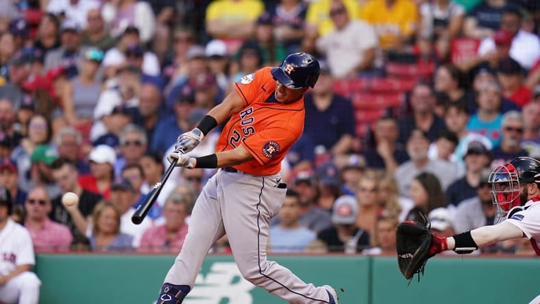 Aug 30, 2023; Boston, Massachusetts, USA; Houston Astros designated hitter Michael Brantley (23) hits a single to right field to drive in two runs against the Boston Red Sox in the third inning at Fenway Park. Mandatory Credit: David Butler II-USA TODAY Sports