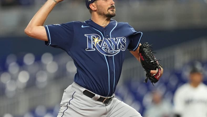 Aug 30, 2023; Miami, Florida, USA; Tampa Bay Rays starting pitcher Zach Eflin (24) pitches against the Miami Marlins in the first inning at loanDepot Park. Mandatory Credit: Jim Rassol-USA TODAY Sports