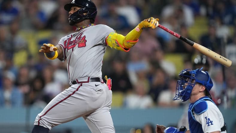 Aug 31, 2023; Los Angeles, California, USA; Atlanta Braves right fielder Ronald Acuna Jr. (13) hits a grand slam home run in the second inning against the Los Angeles Dodger at Dodger Stadium. Mandatory Credit: Kirby Lee-USA TODAY Sports