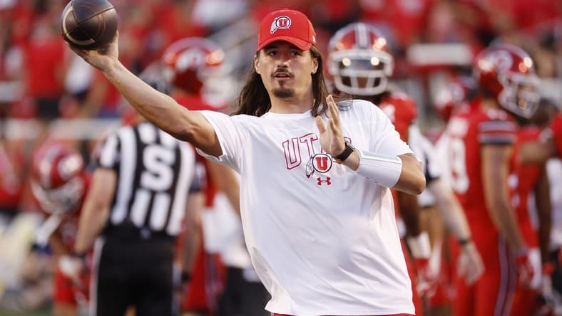 Aug 31, 2023; Salt Lake City, Utah, USA; Utah Utes quarterback Cameron Rising (7), out with an injury warms his quarterback up at halftime against the Florida Gators at Rice-Eccles Stadium. Mandatory Credit: Jeff Swinger-USA TODAY Sports
