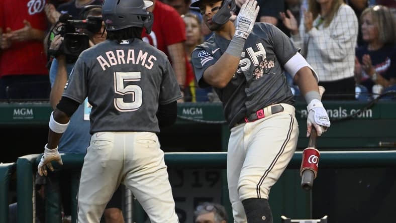 Sep 1, 2023; Washington, District of Columbia, USA; Washington Nationals shortstop CJ Abrams (5) is congratulated by designated hitter Joey Meneses (45) after hitting a solo home run against the Miami Marlins during the first inning at Nationals Park. Mandatory Credit: Brad Mills-USA TODAY Sports