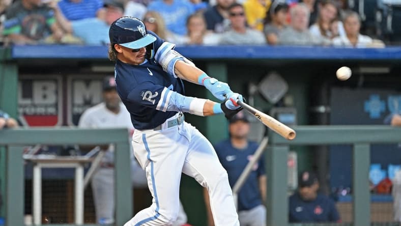 Sep 1, 2023; Kansas City, Missouri, USA;  Kansas City Royals shortstop Bobby Witt Jr. (7) hits a solo home run in the first inning against the Boston Red Sox at Kauffman Stadium. Mandatory Credit: Peter Aiken-USA TODAY Sports
