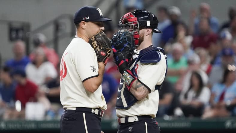 Sep 1, 2023; Arlington, Texas, USA; Texas Rangers relief pitcher Brock Burke (46) and Texas Rangers catcher Jonah Heim (28) talk on mound between pitches against the Minnesota Twins at Globe Life Field. Mandatory Credit: Raymond Carlin III-USA TODAY Sports