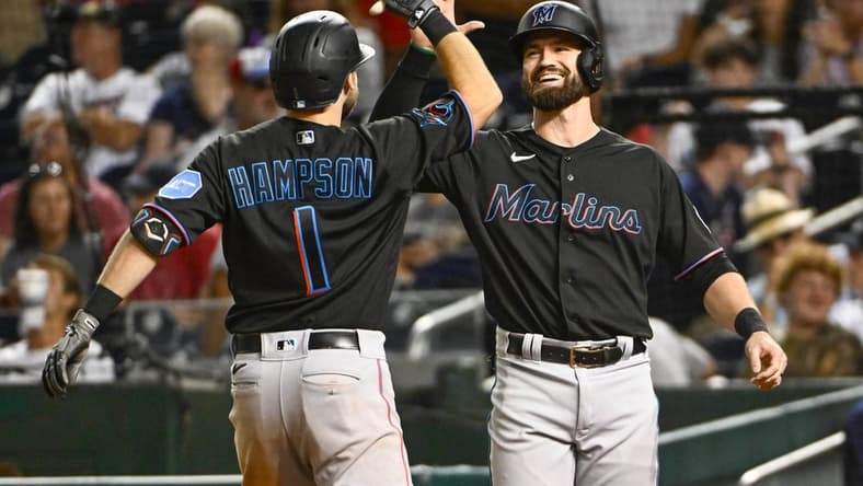 Sep 1, 2023; Washington, District of Columbia, USA; Miami Marlins center fielder Garrett Hampson (1) is congratulated by shortstop Jon Berti (5) after hitting a two run home run during the eleventh inning against the Washington Nationals at Nationals Park. Mandatory Credit: Brad Mills-USA TODAY Sports