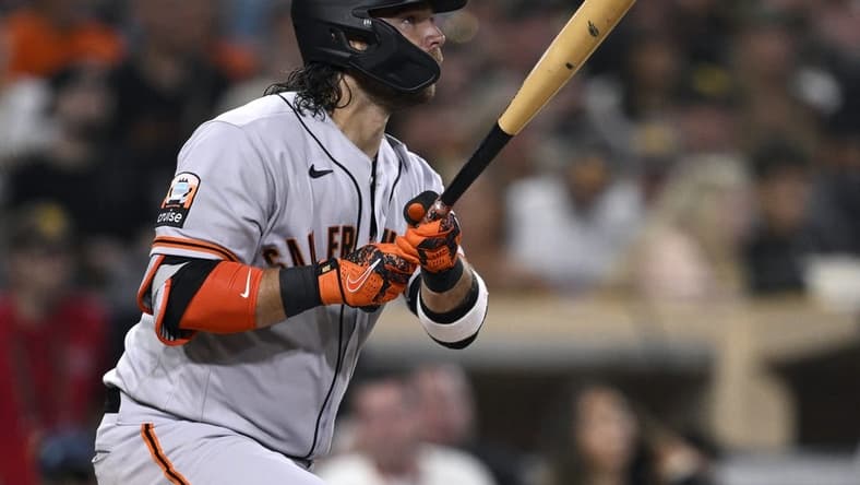 Sep 1, 2023; San Diego, California, USA; San Francisco Giants shortstop Brandon Crawford (35) hits a sacrifice fly against the San Diego Padres during the fourth inning at Petco Park. Mandatory Credit: Orlando Ramirez-USA TODAY Sports