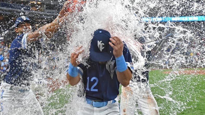 Sep 1, 2023; Kansas City, Missouri, USA;  Kansas City Royals designated hitter Nick Loftin (12) gets doused with water following a win over the Boston Red Sox at Kauffman Stadium. Mandatory Credit: Peter Aiken-USA TODAY Sports