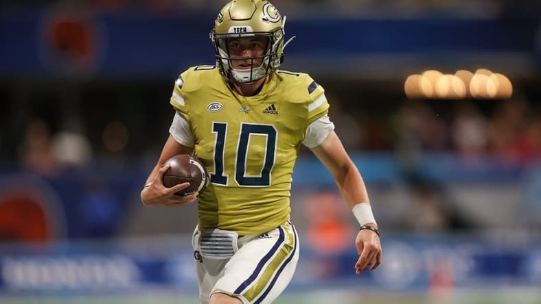 Sep 1, 2023; Atlanta, Georgia, USA; Georgia Tech Yellow Jackets quarterback Haynes King (10) runs the ball against the Louisville Cardinals in the fourth quarter at Mercedes-Benz Stadium. Mandatory Credit: Brett Davis-USA TODAY Sports