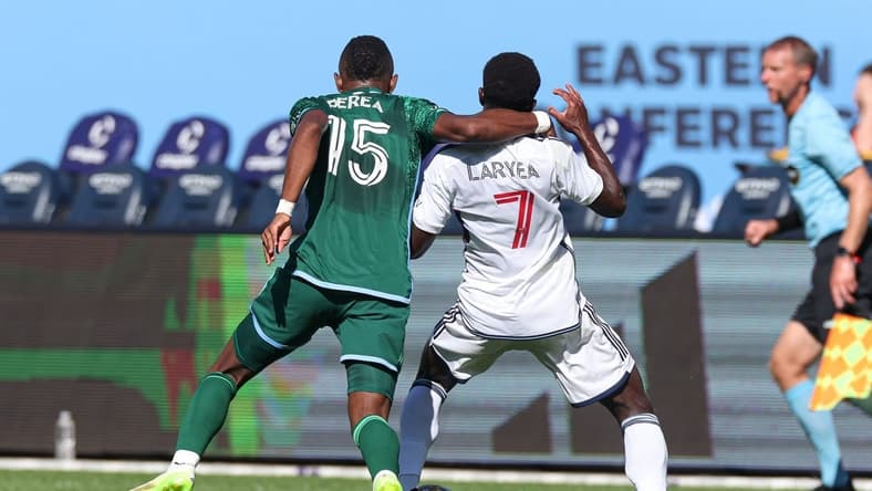 Sep 2, 2023; New York, New York, USA; New York City FC midfielder Andres Perea (15) fouls Vancouver Whitecaps forward Richie Laryea (7) during the first half at Yankee Stadium. Mandatory Credit: Vincent Carchietta-USA TODAY Sports