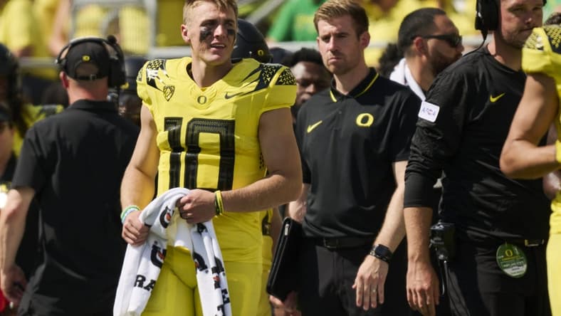 Sep 2, 2023; Eugene, Oregon, USA; Oregon Ducks quarterback Bo Nix (10) watches the game from the sidelines during the second half against the Portland State Vikings at Autzen Stadium. Mandatory Credit: Troy Wayrynen-USA TODAY Sports