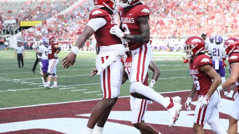Sep 2, 2023; Little Rock, Arkansas, USA; Arkansas Razorbacks quarterback KJ Jefferson (1) and wide receiver Andrew Armstrong (2) celebrate after a touchdown against the Western Carolina Catamounts at War Memorial Stadium. Arkansas won 56-13. Mandatory Credit: Nelson Chenault-USA TODAY Sports