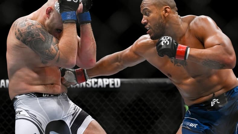 Sep 2, 2023; Paris, France; Ciryl Gane (red gloves) fights Serghei Spivac (blue gloves) during UFC Fight Night at Accor Arena. Mandatory Credit: Per Haljestam-USA TODAY Sports