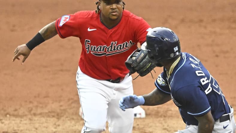 Sep 2, 2023; Cleveland, Ohio, USA; Cleveland Guardians third baseman Jose Ramirez (11) tags out Tampa Bay Rays left fielder Randy Arozarena (56) in the fifth inning at Progressive Field. Mandatory Credit: David Richard-USA TODAY Sports