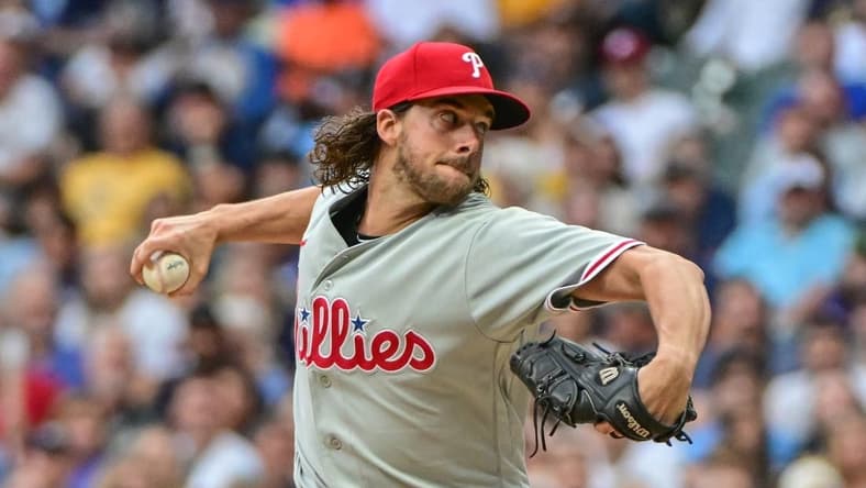 Sep 2, 2023; Milwaukee, Wisconsin, USA;  Philadelphia Phillies pitcher Aaron Nola (27) pitches in the first inning against the Milwaukee Brewers at American Family Field. Mandatory Credit: Benny Sieu-USA TODAY Sports