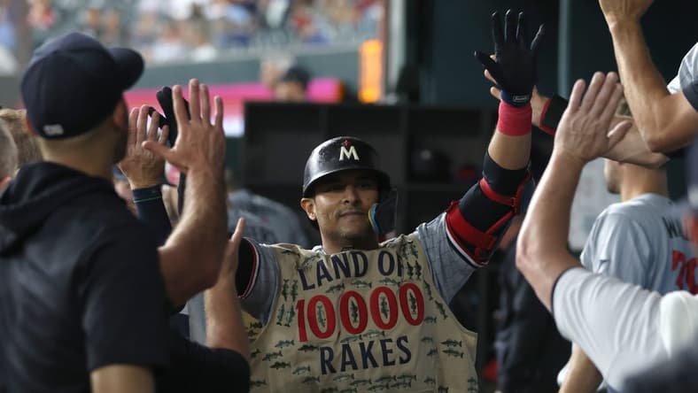 Sep 2, 2023; Arlington, Texas, USA; Minnesota Twins first baseman Donovan Solano (39) is congratulated by his teammates in the dugout after hitting a home run against the Texas Rangers in the third inning at Globe Life Field. Mandatory Credit: Tim Heitman-USA TODAY Sports