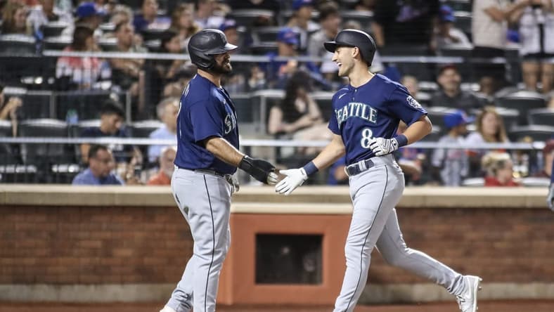 Sep 2, 2023; New York City, New York, USA;  Seattle Mariners pinch hitter Dominic Canzone (8) is greeted by Seattle Mariners pinch runner Mike Ford (20) after hitting a two run home run in the sixth inning against the New York Mets at Citi Field. Mandatory Credit: Wendell Cruz-USA TODAY Sports