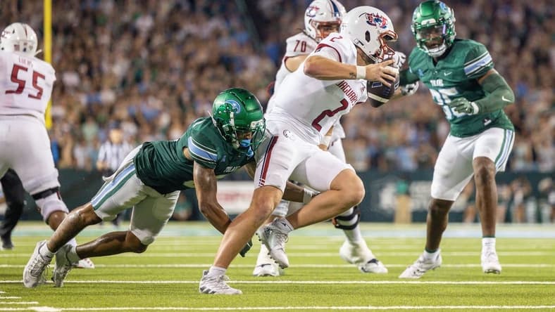 Sep 2, 2023; New Orleans, Louisiana, USA;  South Alabama Jaguars quarterback Carter Bradley (2) scrambles out the pocket to avoid the sack of Tulane Green Wave safety Kam Pedescleaux (8) during the first half at Yulman Stadium. Mandatory Credit: Stephen Lew-USA TODAY Sports