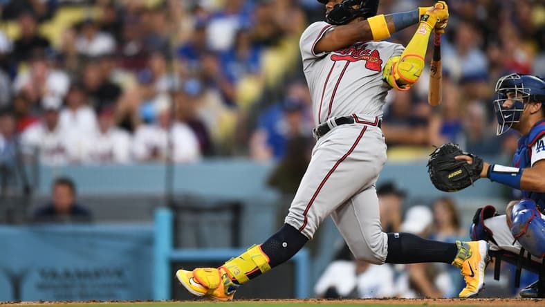 Sep 2, 2023; Los Angeles, California, USA; Atlanta Braves right fielder Ronald Acuna Jr. (13) hits a home run against the Los Angeles Dodgers during the third inning at Dodger Stadium. Mandatory Credit: Jonathan Hui-USA TODAY Sports