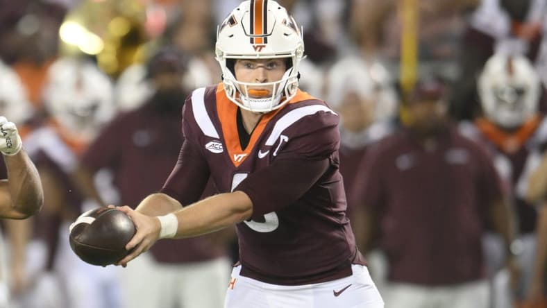 Sep 2, 2023; Blacksburg, Virginia, USA;  Virginia Tech Hokies quarterback Grant Wells (6)  hands off ball in the second quarter against the Old Dominion Monarchs at Lane Stadium. Mandatory Credit: Lee Luther Jr.-USA TODAY Sports