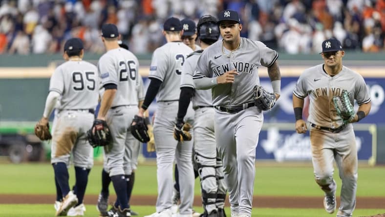 Sep 2, 2023; Houston, Texas, USA; New York Yankees center fielder Jasson Dominguez (89) and teammates celebrate the win against the Houston Astros at Minute Maid Park. Mandatory Credit: Thomas Shea-USA TODAY Sports