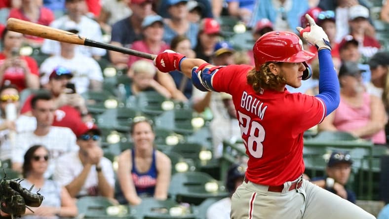 Sep 3, 2023; Milwaukee, Wisconsin, USA; Philadelphia Phillies first baseman Alec Bohm (28) hits a solo home run in the seventh inning against the Milwaukee Brewers at American Family Field. Mandatory Credit: Benny Sieu-USA TODAY Sports