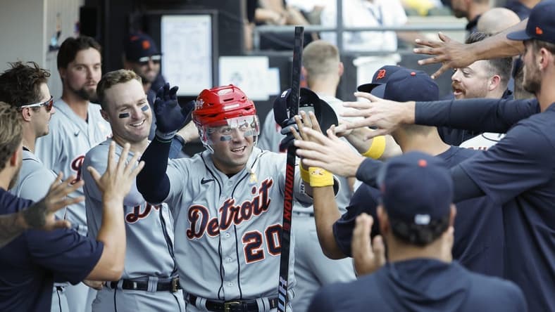 Sep 3, 2023; Chicago, Illinois, USA; Detroit Tigers first baseman Spencer Torkelson (20) celebrates with teammates after hitting a solo home run against the Chicago White Sox during the seventh inning at Guaranteed Rate Field. Mandatory Credit: Kamil Krzaczynski-USA TODAY Sports
