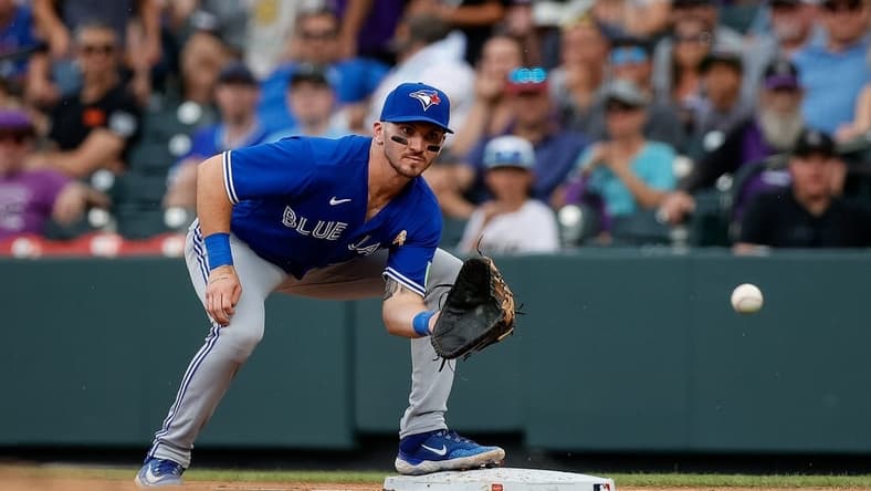 Sep 3, 2023; Denver, Colorado, USA; Toronto Blue Jays first baseman Spencer Horwitz (48) fields a throw to first in the fourth inning against the Colorado Rockies at Coors Field. Mandatory Credit: Isaiah J. Downing-USA TODAY Sports