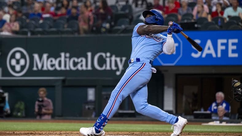 Sep 3, 2023; Arlington, Texas, USA; Texas Rangers right fielder Adolis Garcia (53) hits a walk off home run for the win over the Minnesota Twins during the ninth inning at Globe Life Field. Mandatory Credit: Jerome Miron-USA TODAY Sports