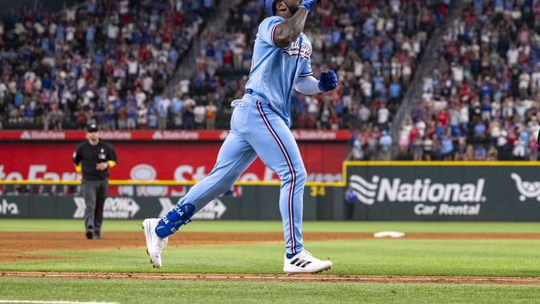 Sep 3, 2023; Arlington, Texas, USA; Texas Rangers right fielder Adolis Garcia (53) celebrates as he rounds the bases after he hits a walk off home run for the win over the Minnesota Twins during the ninth inning at Globe Life Field. Mandatory Credit: Jerome Miron-USA TODAY Sports