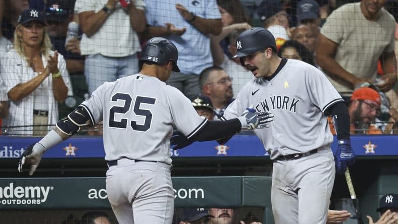 Sep 3, 2023; Houston, Texas, USA; New York Yankees second baseman Gleyber Torres (25) celebrates with catcher Austin Wells (88) after hitting a home run during the ninth inning against the Houston Astros at Minute Maid Park. Mandatory Credit: Troy Taormina-USA TODAY Sports