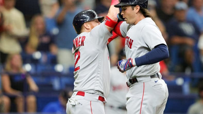Sep 4, 2023; St. Petersburg, Florida, USA;  Boston Red Sox designated hitter Justin Turner (2) congratulates first baseman Triston Casas (36) after hitting a there-run home run against the Tampa Bay Rays in the sixth inning at Tropicana Field. Mandatory Credit: Nathan Ray Seebeck-USA TODAY Sports