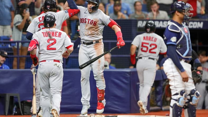 Sep 4, 2023; St. Petersburg, Florida, USA; Boston Red Sox right fielder Adam Duvall (18) congratulates first baseman Triston Casas (36) after hitting a there-run home run against the Tampa Bay Rays in the sixth inning at Tropicana Field. Mandatory Credit: Nathan Ray Seebeck-USA TODAY Sports