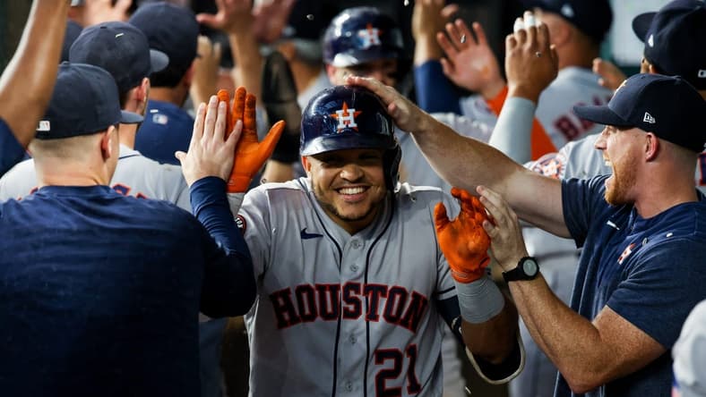 Sep 4, 2023; Arlington, Texas, USA; Houston Astros catcher Yainer Diaz (21) celebrates with teammates after hitting a three-run home run during the seventh inning against the Texas Rangers at Globe Life Field. Mandatory Credit: Kevin Jairaj-USA TODAY Sports