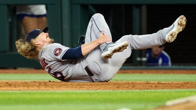 Sep 4, 2023; Arlington, Texas, USA;  Houston Astros relief pitcher Ryne Stanek (45) injures himself during the ninth inning against the Texas Rangers at Globe Life Field. Mandatory Credit: Kevin Jairaj-USA TODAY Sports