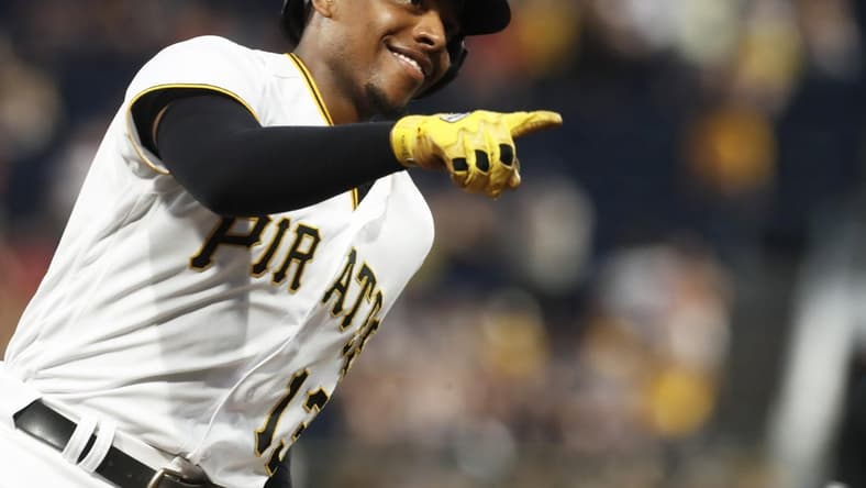 Sep 4, 2023; Pittsburgh, Pennsylvania, USA;  Pittsburgh Pirates third baseman Ke'Bryan Hayes (13) gestures to the dugout as he circles the bases on a solo home run against the Milwaukee Brewers during the fifth inning at PNC Park. Mandatory Credit: Charles LeClaire-USA TODAY Sports