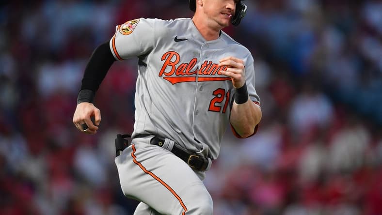 Sep 4, 2023; Anaheim, California, USA; Baltimore Orioles left fielder Austin Hays (21) hits an RBI double against the Los Angeles Angels during the third inning at Angel Stadium. Mandatory Credit: Gary A. Vasquez-USA TODAY Sports