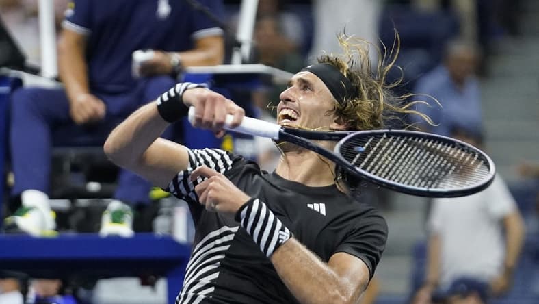 Sep 4, 2023; Flushing, NY, USA; Alexander Zverev of Germany hits a ball into the crowd after defeating Jannik Sinner of Italy on day eight of the 2023 U.S. Open tennis tournament at USTA Billie Jean King National Tennis Center. Mandatory Credit: Danielle Parhizkaran-USA TODAY Sports