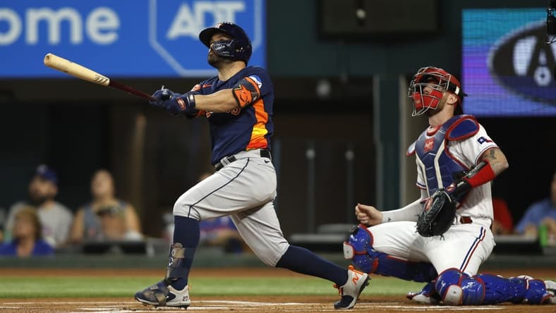 Sep 5, 2023; Arlington, Texas, USA; Houston Astros second baseman Jose Altuve (27) hits a solo home run in the first inning against the Texas Rangers at Globe Life Field. Mandatory Credit: Tim Heitman-USA TODAY Sports