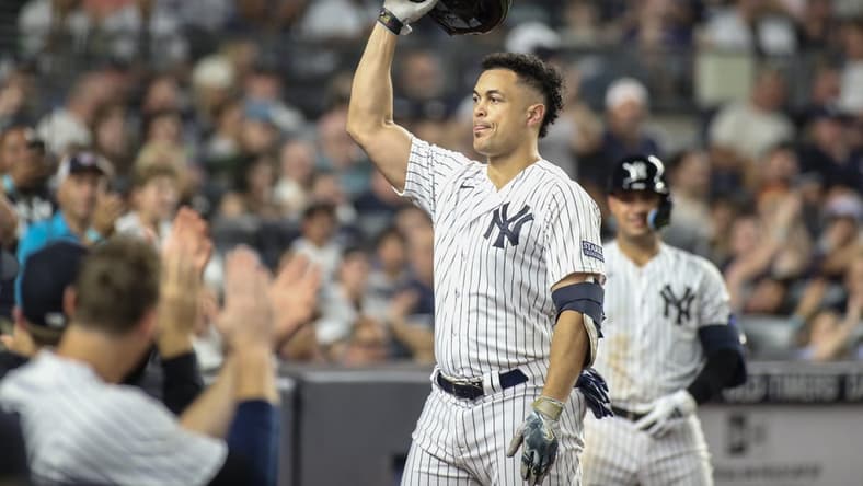 Sep 5, 2023; Bronx, New York, USA;  New York Yankees designated hitter Giancarlo Stanton (27) gives the fans a curtain call after hitting a two run home run in the sixth inning for his 400th career home run against the Detroit Tigers at Yankee Stadium. Mandatory Credit: Wendell Cruz-USA TODAY Sports