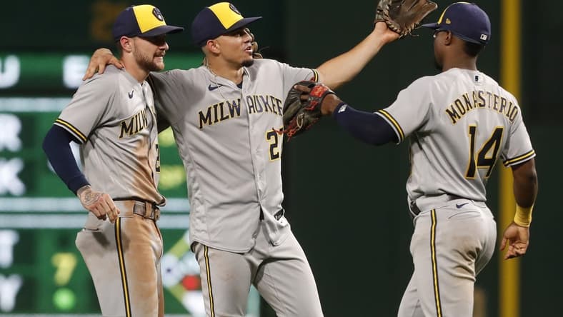 Sep 5, 2023; Pittsburgh, Pennsylvania, USA; Milwaukee Brewers second baseman Brice Turang (2) and shortstop Willy Adames (27) and third baseman Andruw Monasterio (14) celebrate after defeating the Pittsburgh Pirates at PNC Park. The Brewers won 7-3. Mandatory Credit: Charles LeClaire-USA TODAY Sports