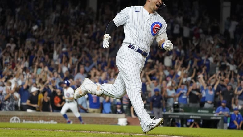Sep 5, 2023; Chicago, Illinois, USA; Chicago Cubs right fielder Seiya Suzuki (27) hits a two-run home run against the San Francisco Giants during the seventh inning at Wrigley Field. Mandatory Credit: David Banks-USA TODAY Sports