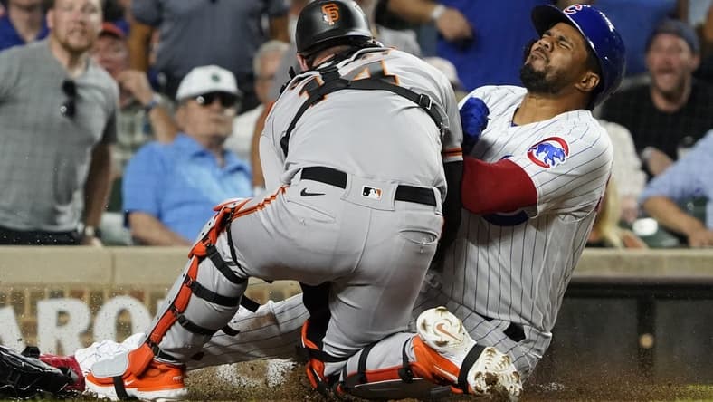Sep 5, 2023; Chicago, Illinois, USA;Chicago Cubs third baseman Jeimer Candelario (9) is safe at home plate as San Francisco Giants catcher Patrick Bailey (14) can   t catch the ball during the seventh inning  at Wrigley Field. Mandatory Credit: David Banks-USA TODAY Sports