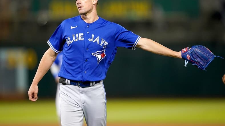 Sep 5, 2023; Oakland, California, USA; Toronto Blue Jays pitcher Chris Bassitt (40) is congratulated by teammates after the Blue Jays recorded the final out of the fifth inning against the Oakland Athletics at Oakland-Alameda County Coliseum. Mandatory Credit: Cary Edmondson-USA TODAY Sports